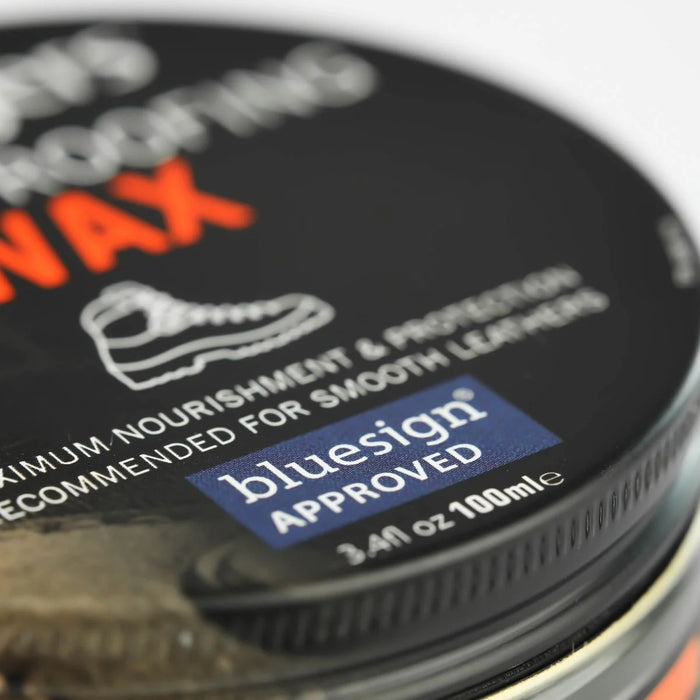 Close-up of a container of shoe wax with 'bluesign' approval label.